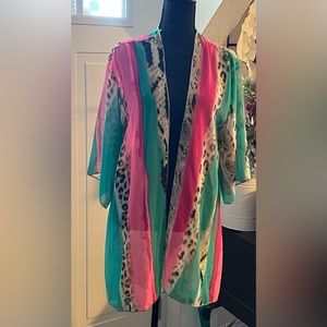 Swim Kimono or shrug in vibrant colors and in size L. With tag new